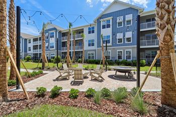 Courtyard patio with swing and fire pit